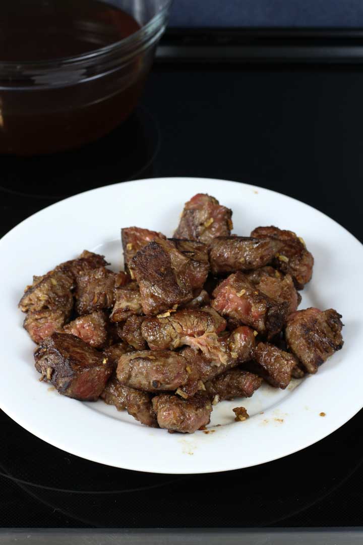 Browned beef resting on a plate