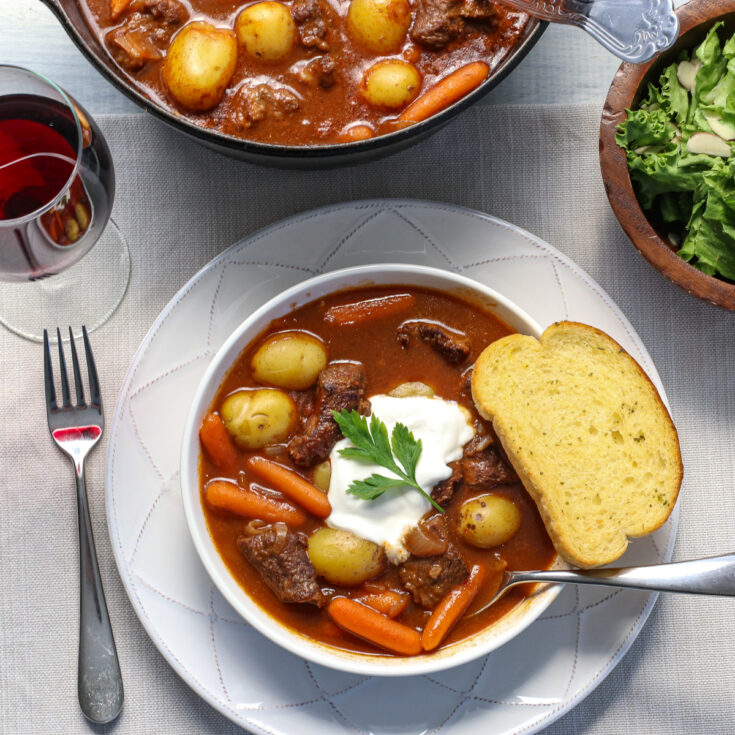 Lipton Recipe secrets beef stew in a bowl with garlic bread