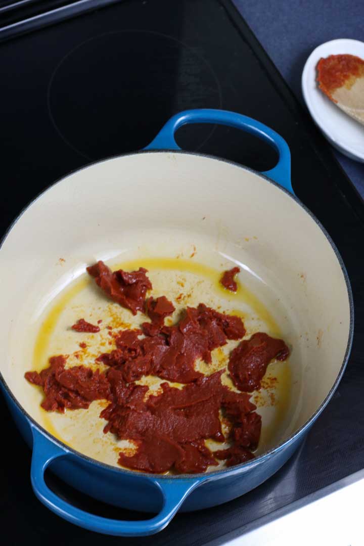 broken up tomato paste in a pot