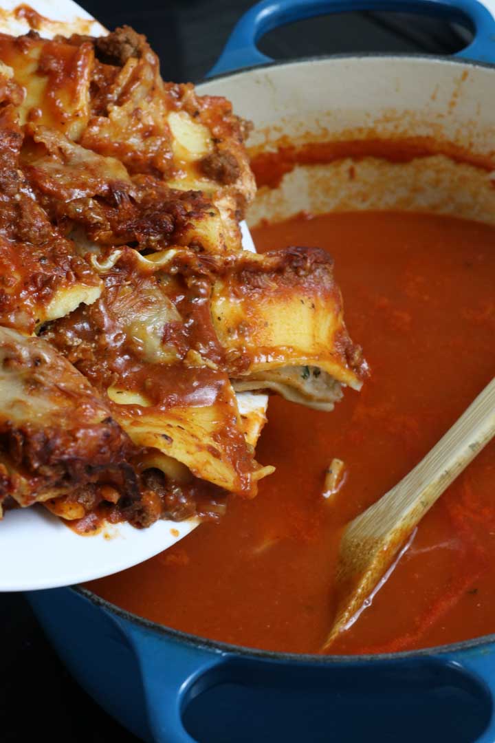Dumping out the lasagna into the soup