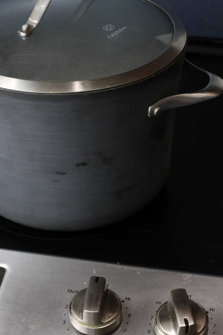 Large pot of water covered to simmer the fava beans