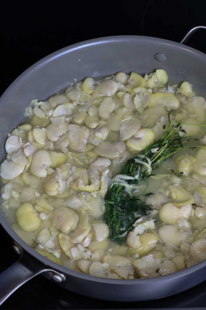 Added fava beans to the broth and herbs.