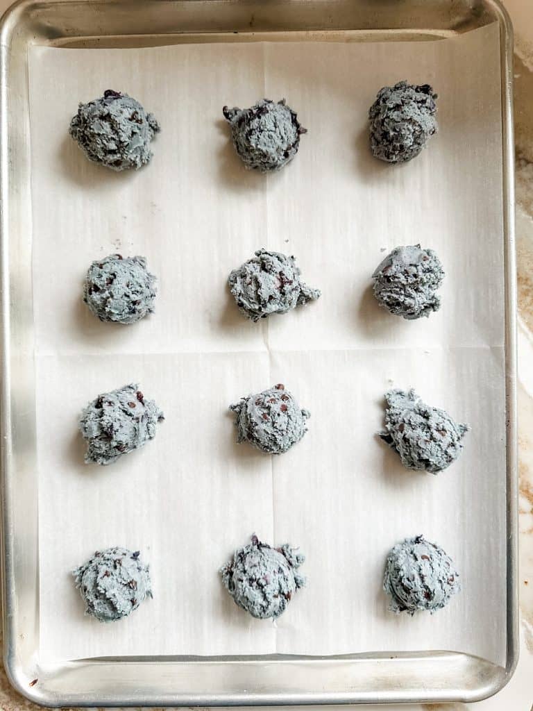 blueberry cookie dough added to baking sheet