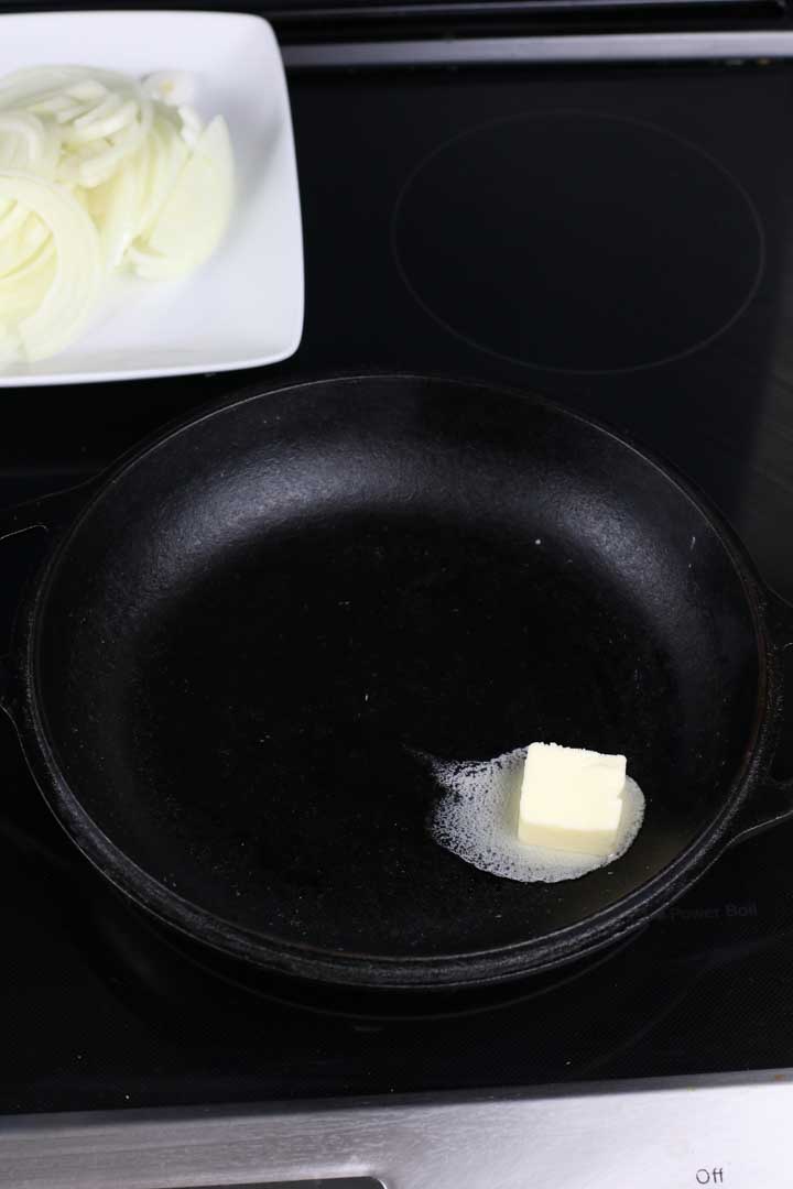 Butter melting in a cast iron pan.