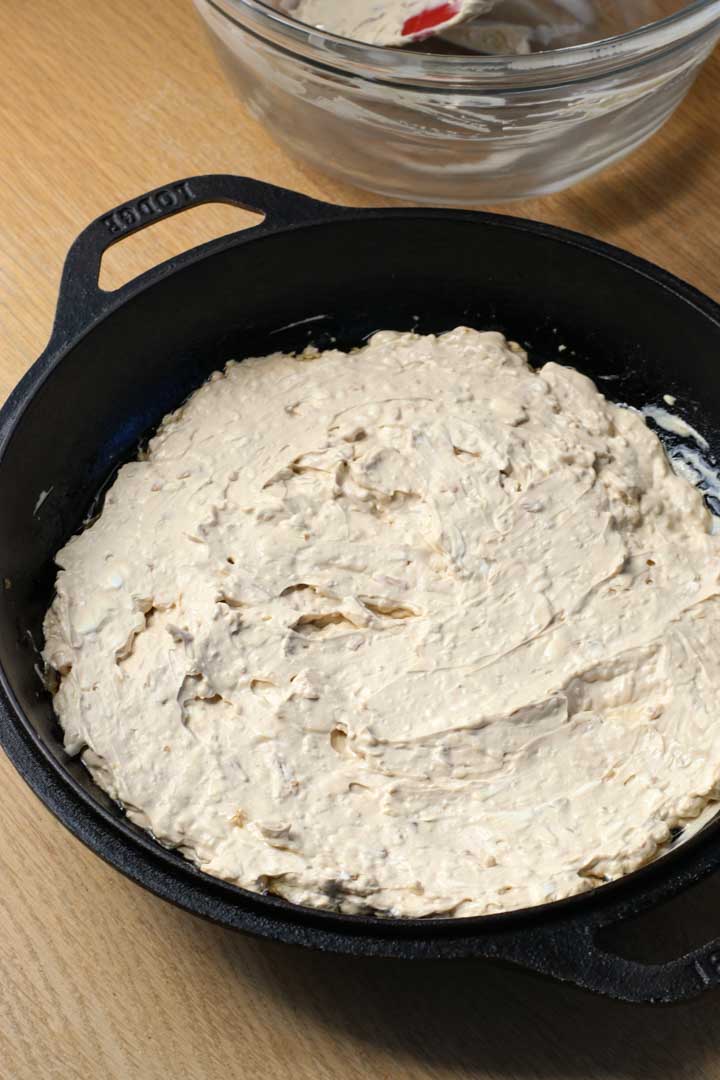 Spreading the onion dip in a pan.