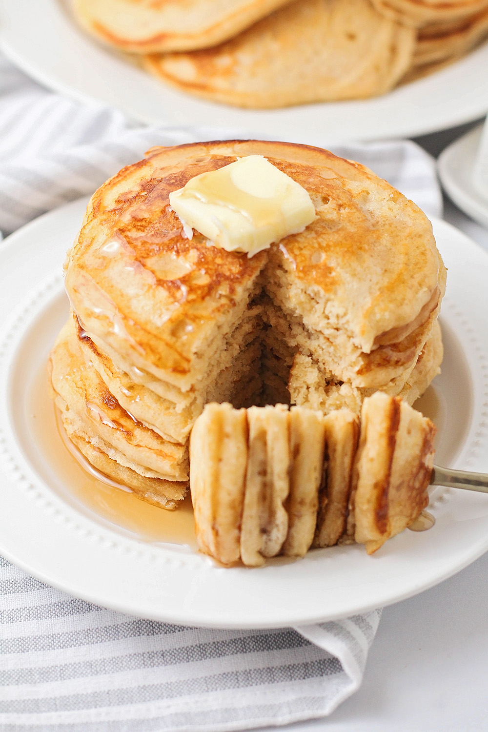 These fluffy and light whole wheat pancakes are so delicious, and quick and easy to make. They're a wholesome breakfast everyone will love!